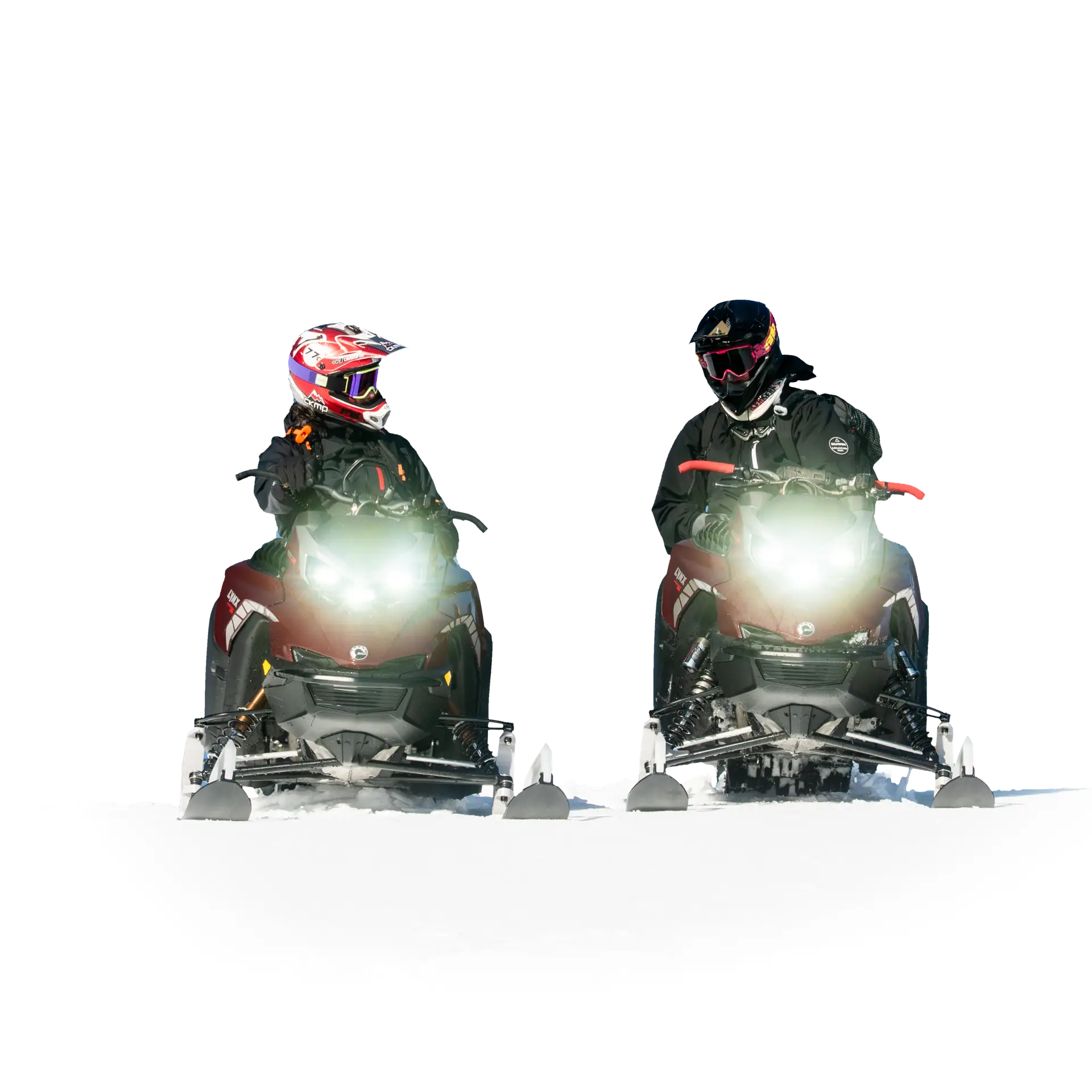 Two snowmobilers riding side by side